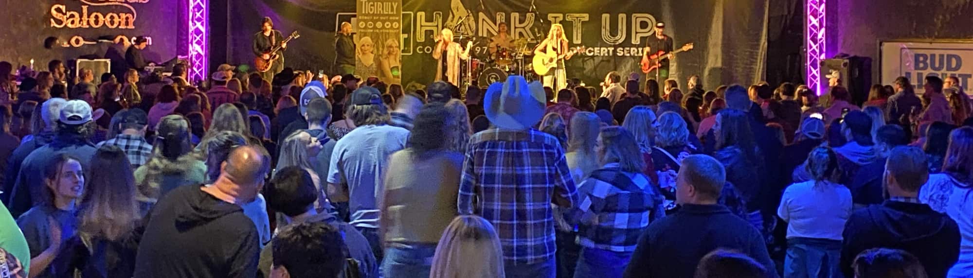 country concert with fans wearing cowboy hats Memphis